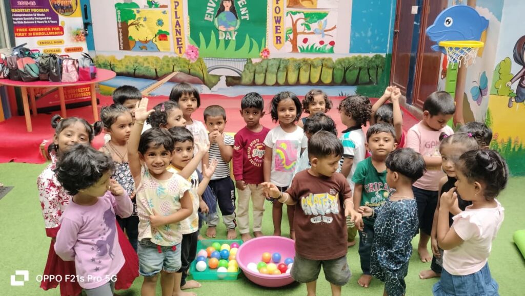 Happy preschoolers playing exciting ball game together at SSCT Bright Kidz