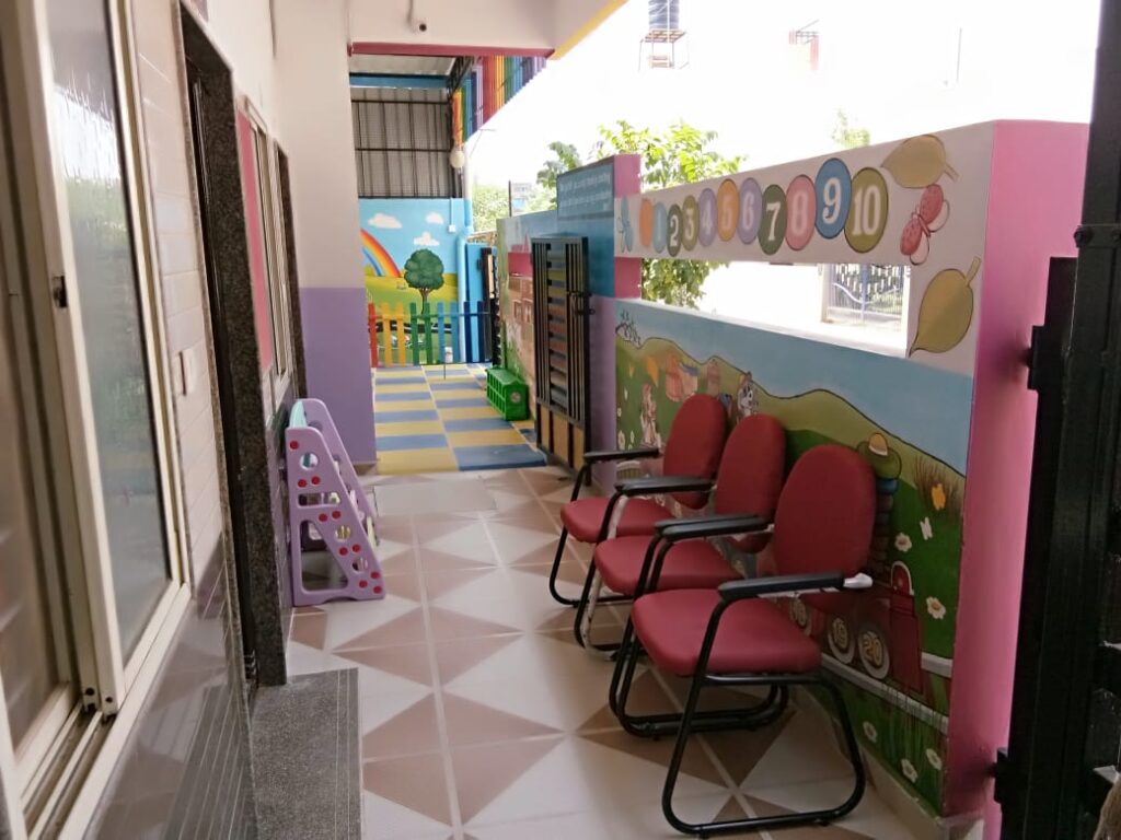 Colorful classroom with fun mural and child-sized tables at SSCT Bright Kidz Preschool